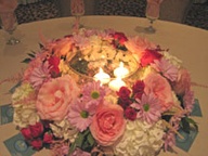 Vase of flowers with candle