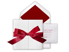 Christmas wedding invitations with red ribbon