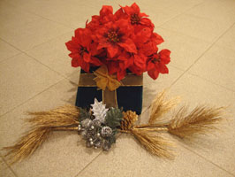 Christmas centerpiece present with flowers