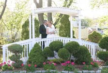 Garden wedding ideas on a bridge over a pond