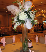 Ostrich feathers with flowers as your bridal centerpiece