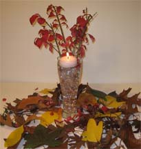 Stunning centerpieces  floating candle with leaves and flowers