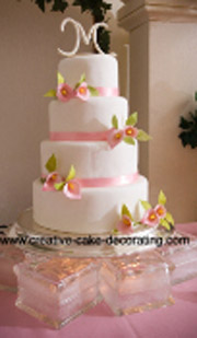 Beautiful four tier cake designs with initial cake topper