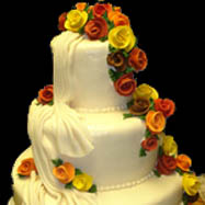 Beautiful cake with autumn colored flowers