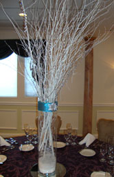 Tall wedding centerpieces of white branches