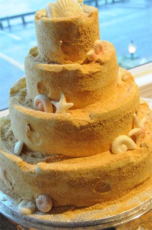 Beach Theme Wedding Cake with seashells and Graham Cracker crumbs as the frosting.