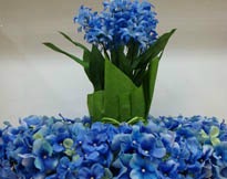 Blue Bridal Centerpiece surrounded by a wreath of blue flowers