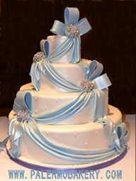 Elegant  wedding cake with light blue fondant draping for the perfect wedding