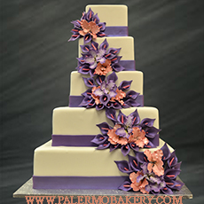 Stunning and elegant wedding cake with purple and orange flowers