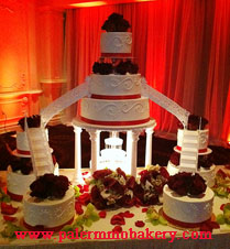 Elegant tiered wedding cake with lots of flowers