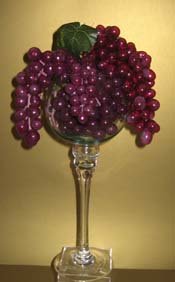 Fruit wedding centerpiece of grapes in a tall glass