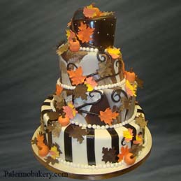 Halloween wedding ideas of a wedding cake with fall leaves
