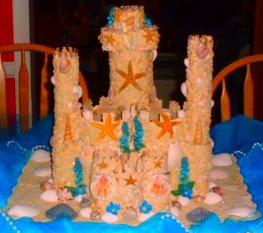Beautiful wedding cake shapped as a sandcastle