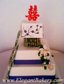 Unique square cake with a "Double Happiness" topper and purple fondant flowers.for a wedding