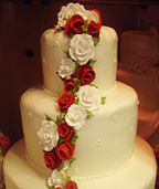Pretty Christmas cake with red and whiteflowers