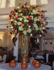 Wedding centerpiece with fall colored flowers