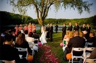 Outdoor ceremony with flowers down the aisle
