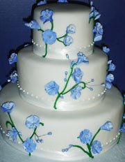 White wedding cake with blue flowers