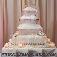 Beautifully decorated wedding cake with pink embllishments