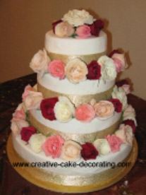 Beautiful four tier wedding cake designs with fresh roses