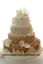 Gorgous multi colored tiered beach theme wedding cake