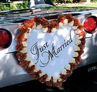 Wedding car decorations with a Just Married sign