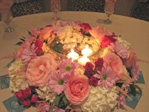 Stunning centerpieces candle surrounded by flowers