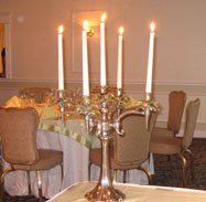 Halloween wedding theme of tall candles as a centerpiece