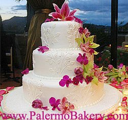 Gorgeous beach themed cake with tropical flowers