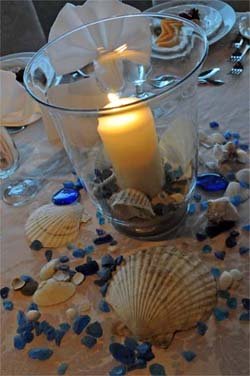 Beach Wedding Idea with candle seashells and blue rocks