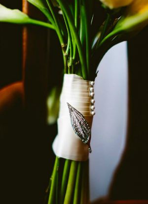 Rhinestone Brooch added to decorate a calla lily wedding bouquet