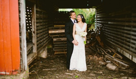 Bride and Groom in a barn for their country wedding ideas