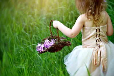 Country Wedding Ideas - Flower girl carrying a basket of hand picked flowers