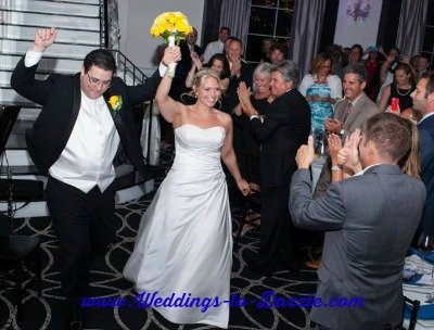 Wedding Photography Poses Bride and Groom Entering Reception
